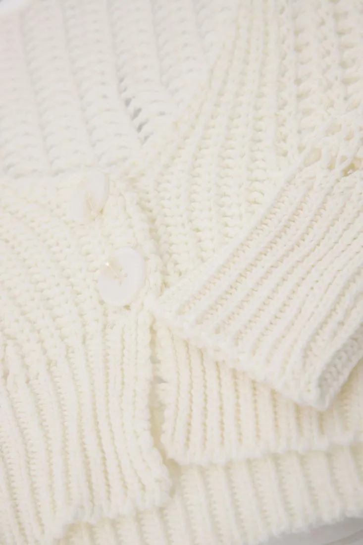 Cardigan oversize cropped traforato con bottoni