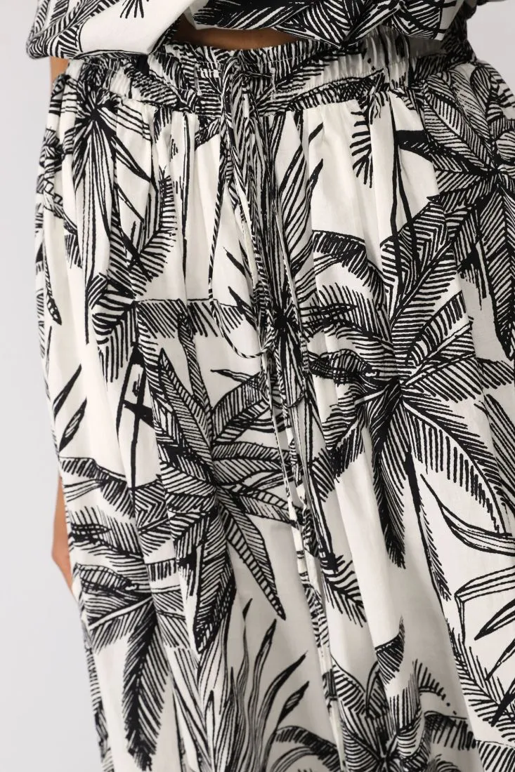 Pantaloni a palazzo fantasia botanica con coulisse e spacchi