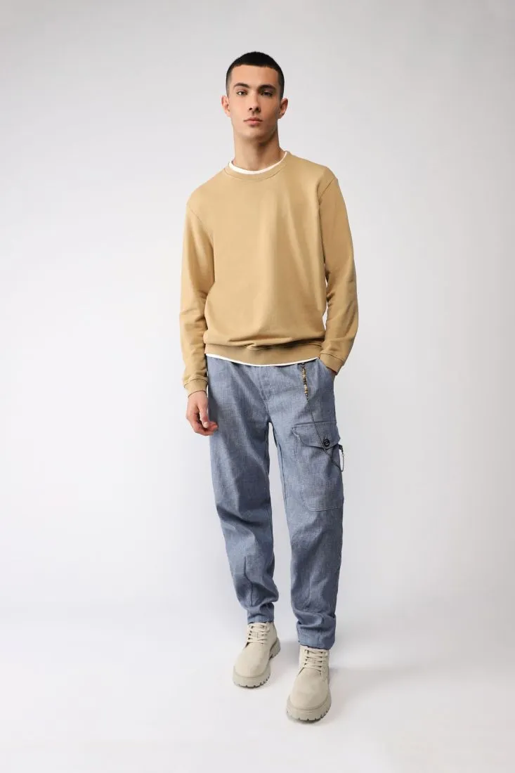 Pantaloni baggy monocolour con pinces e tasca laterale
